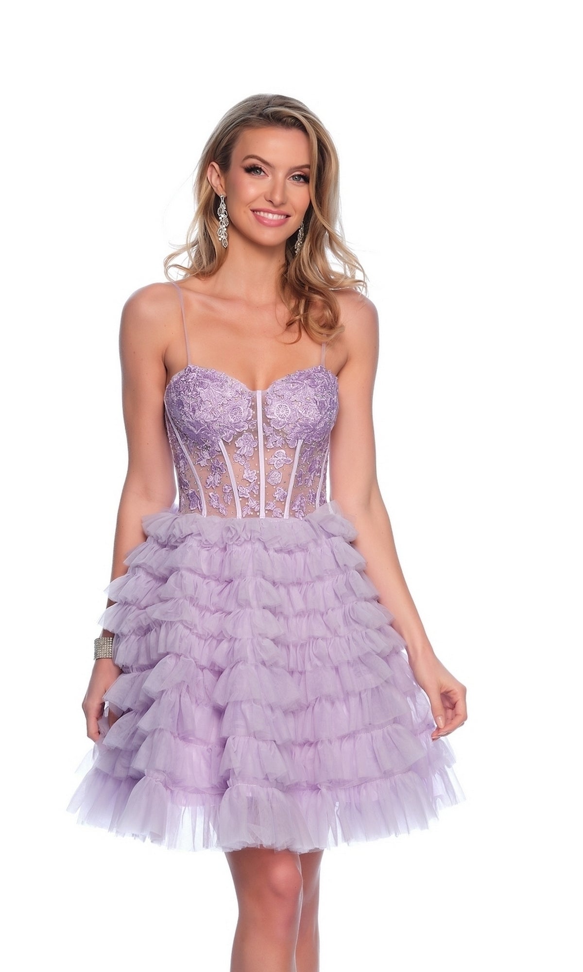 A woman models the Dave and Johnny Ruffled Purple Hoco Dress 11766, a short lavender dress with a corset-style bodice, spaghetti straps, and ruffled details, standing against a plain white background.